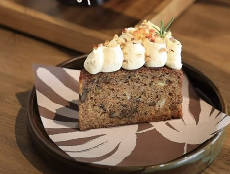 Carrot cake slice with cream cheese frosting